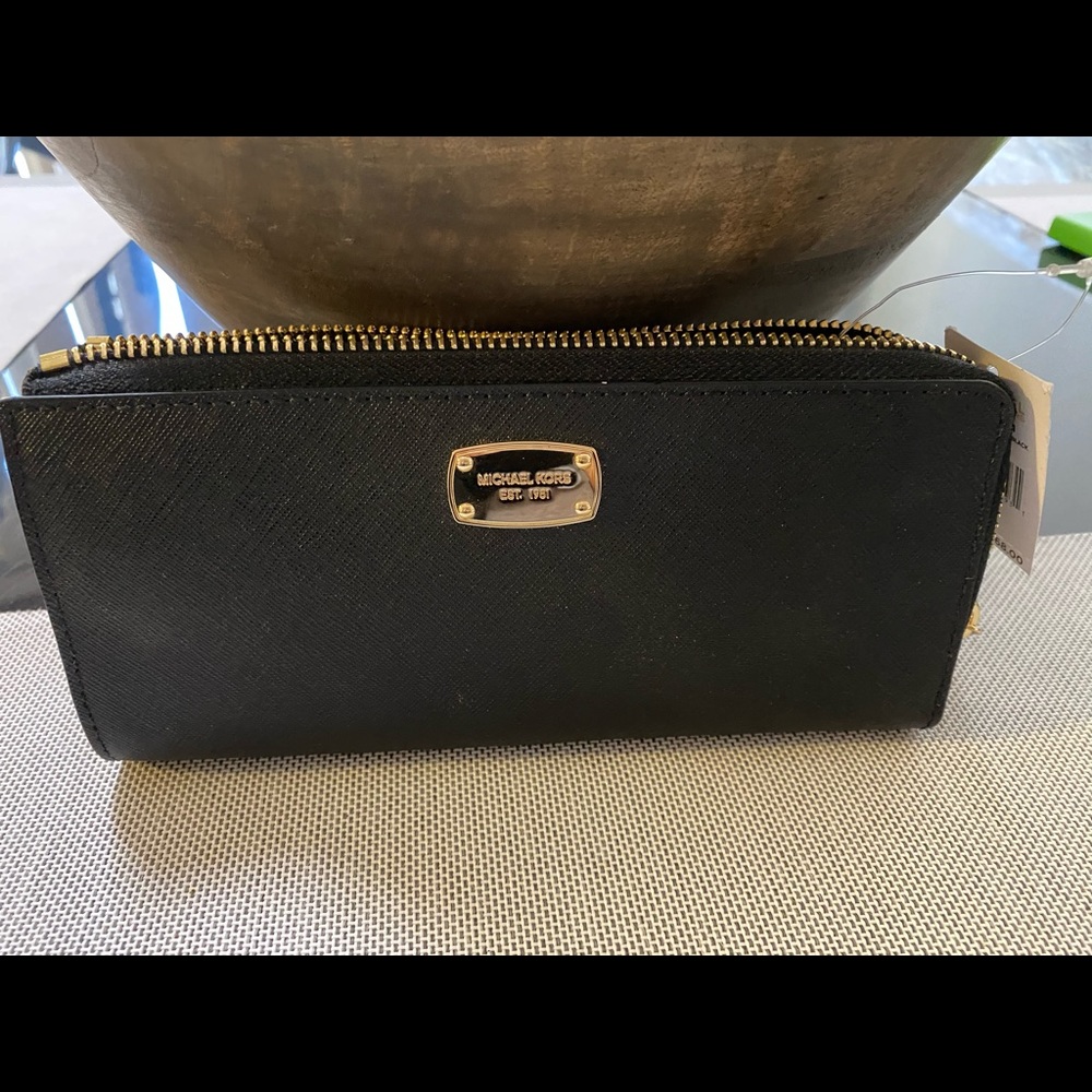 NWT. Michael Kors zippy wallet .   Black